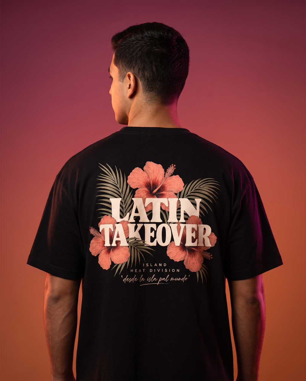 Island Heat Tee back hibiscus graphic worn by model, Latin Takeover sunset studio