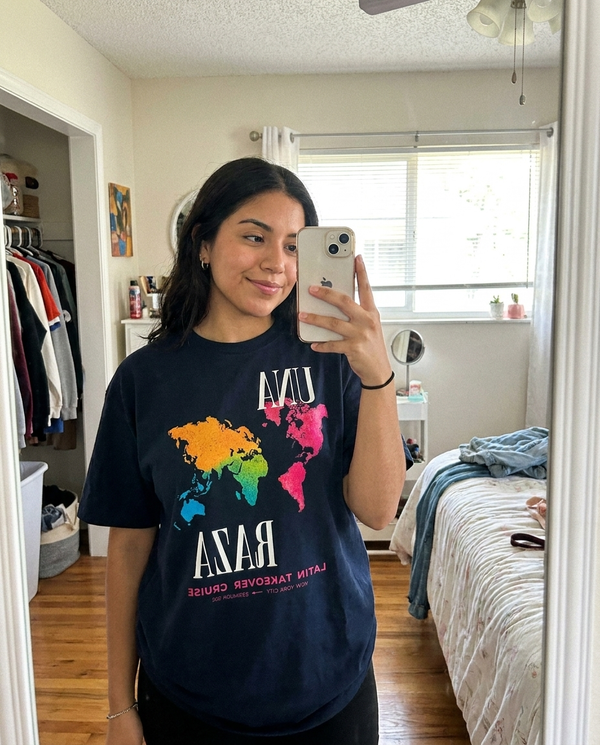 Customer mirror selfie in Una Raza tee