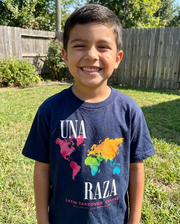 Kid wearing Una Raza kids tee