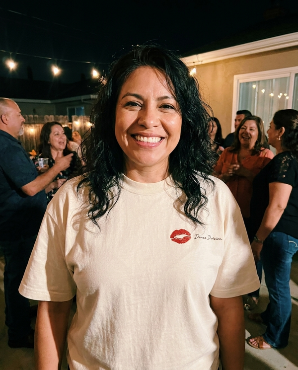 Customer in Dance Division tee at a party