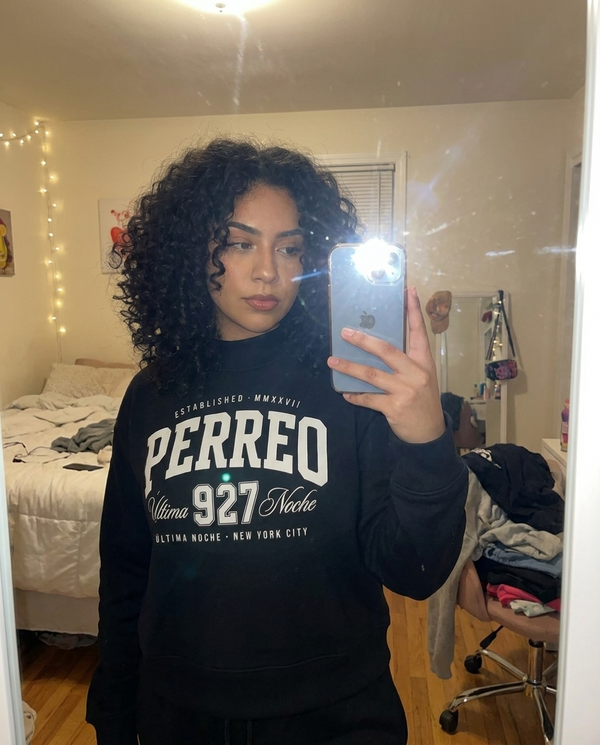 Customer mirror selfie in Perreo sweatshirt