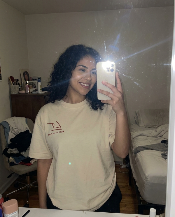 Customer mirror selfie in Rules of the Floor tee